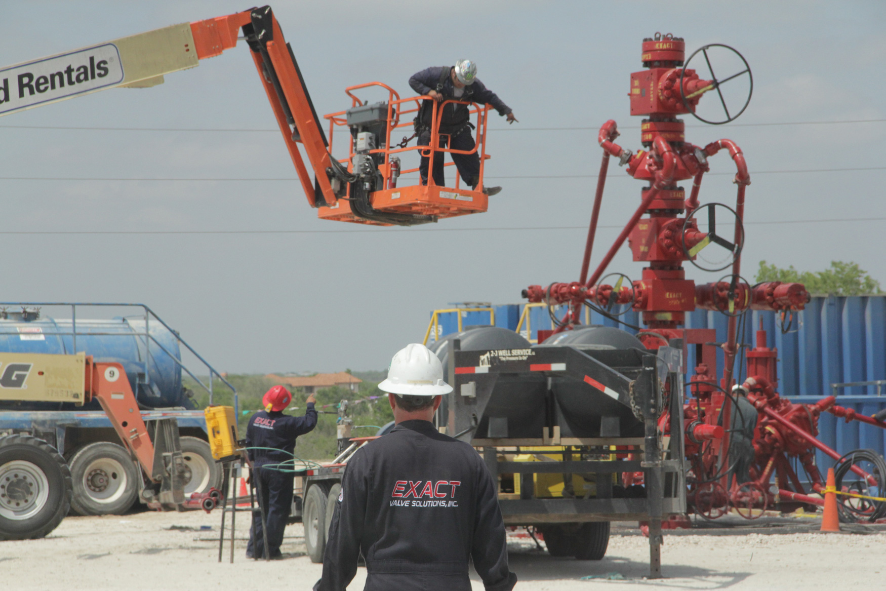 Exact Valve employees rigging up a Frac Stack and Zipper Manifold